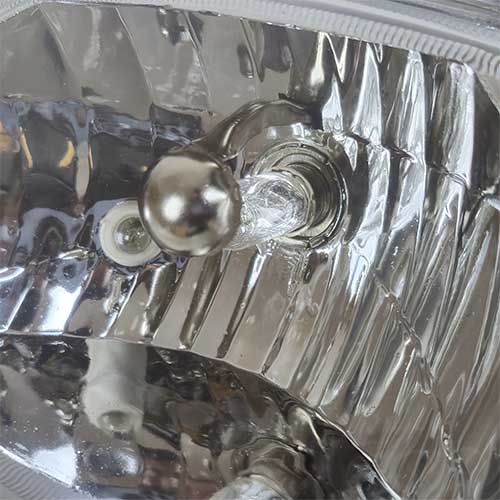 FAROL DEL. (OPTICA) HONDA C100 BIZ/GUERRERO TRIP (GIRO NARANJA) MTC EXCLU